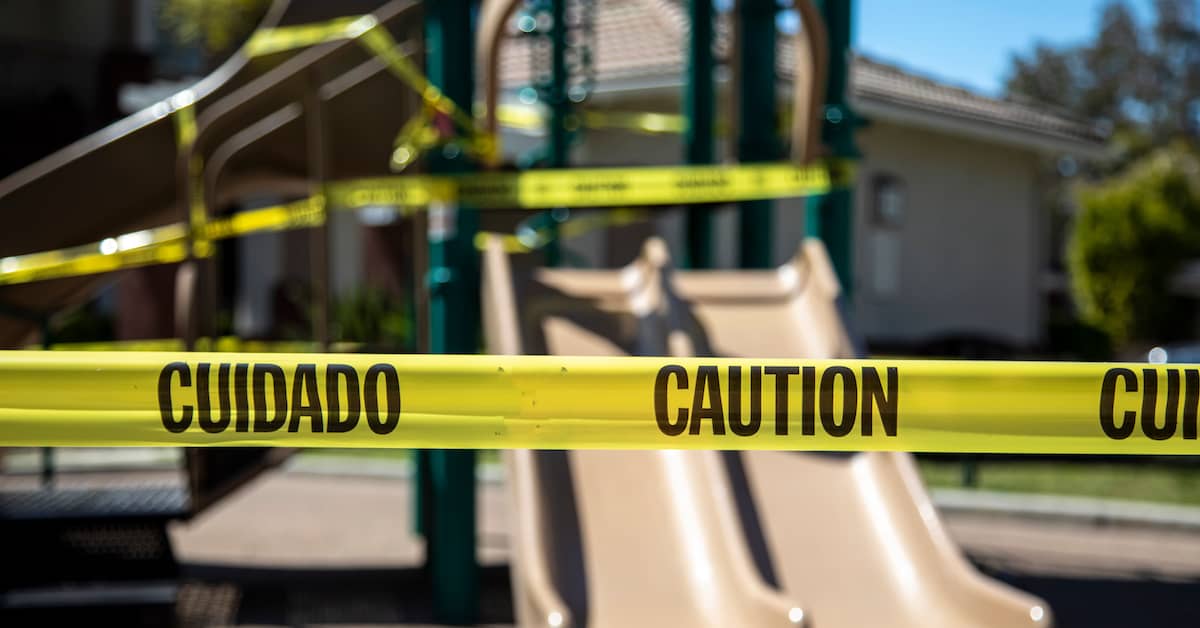 Dangerous playground equipment with caution tape. | Colling Gilbert Wright