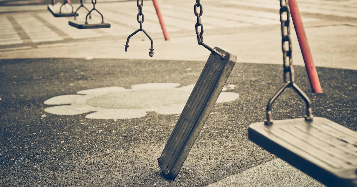 Broken swing on a playground. | Colling Gilbert Wright